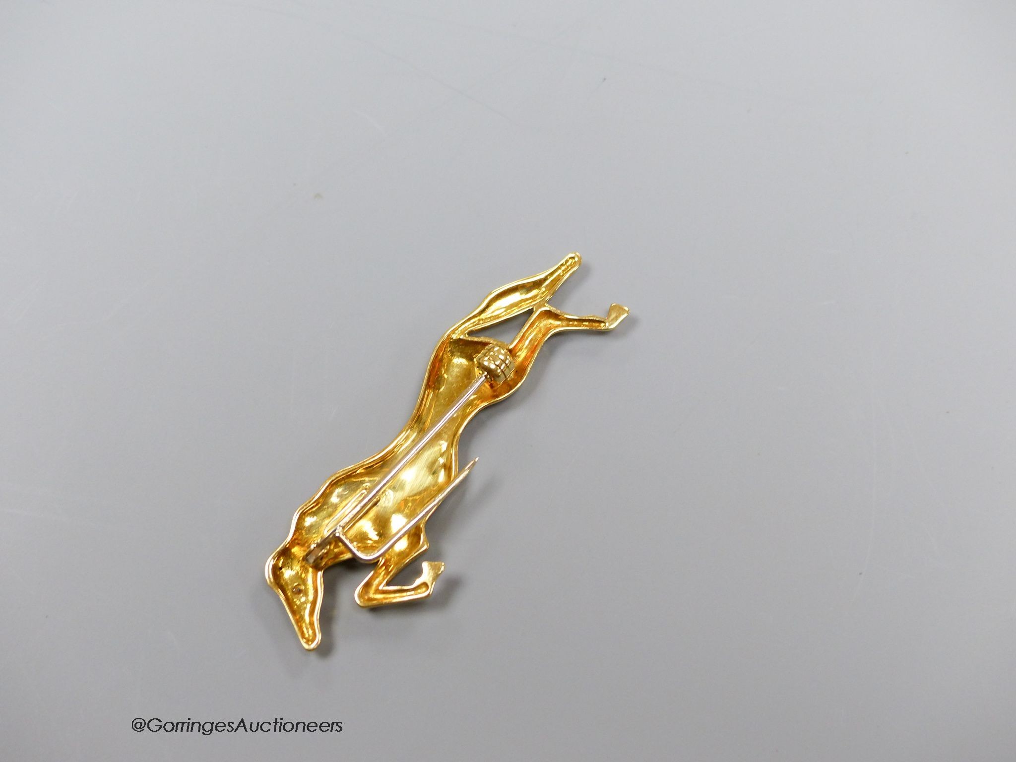 An 18k gold (750) diamond set horse brooch, gross 6.3g, 5cm.